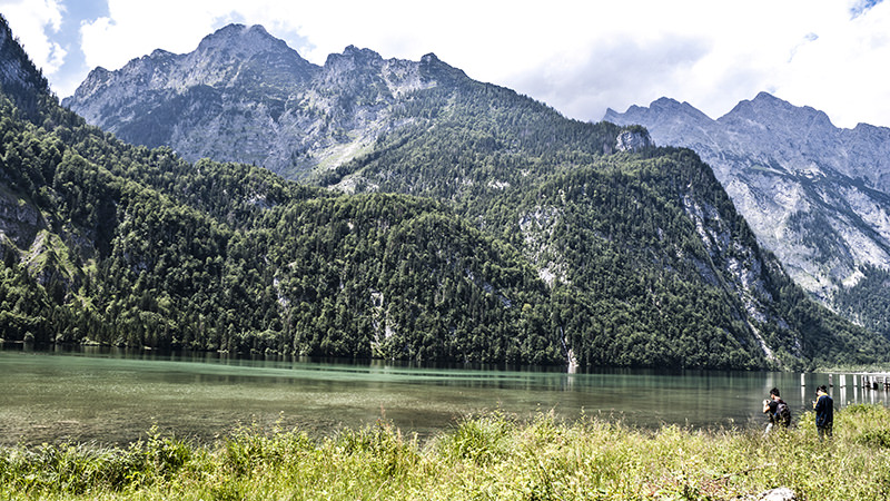 Mountains, lake, and hikers at Lake Königssee