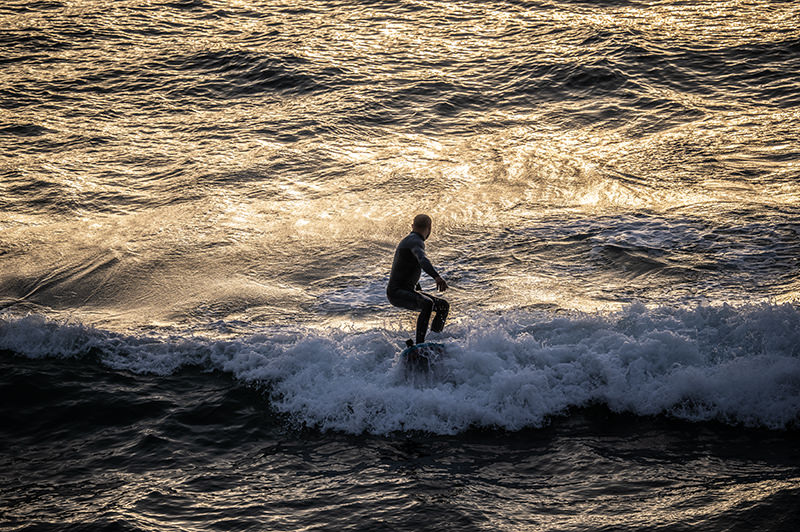 Surfing at sunset